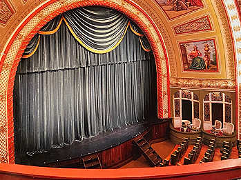 Curtains, stage, and seats inside the haunted Calumet Theatre in Calumet, Michigan.