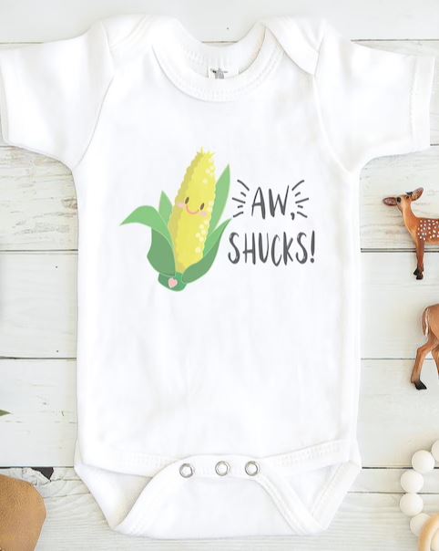 White onesie for kids that reads, Aw Shucks!