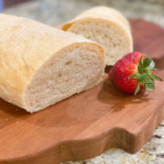 French Bread sitting on a cutting board