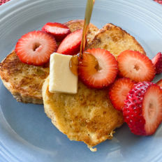 Pouring syrup on homemade french toast!