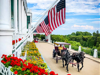 Mackinac Island Grand Hotel, with horse and carriage near the main entrance