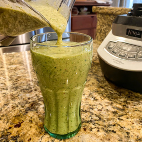 Green Smoothie in a glass on the counter