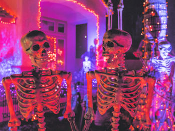 Spooky skeletons in pink and blue light