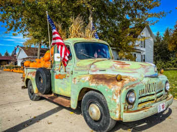 Old truck filled with pumpkins