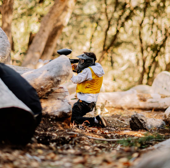 Person with gun Playing Paintball