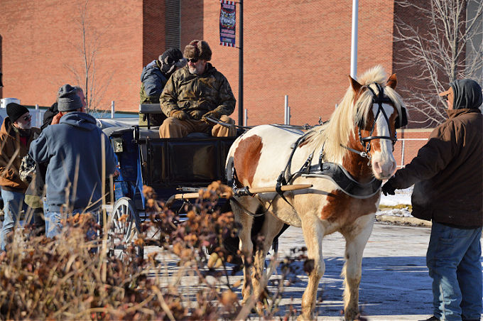Chilly Fest-Man offering horse-drawn carriage rides during the event.