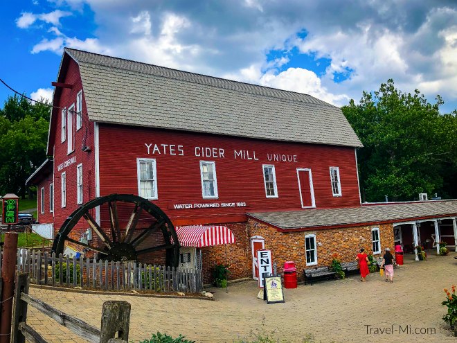 Yates Cider Mill's Iconic red barn and water wheel